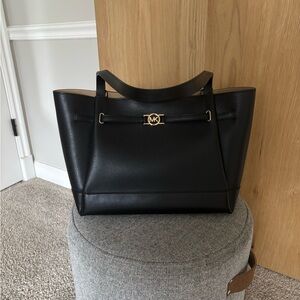 Michael Kors Elegant Black Tote with Gold Accent.